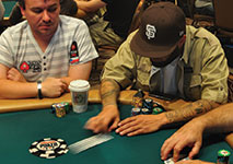 Poker player mucking hand